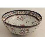 A 19th century Samson of Paris porcelain punch bowl, decorated with flowers, af, diameter 11.5ins,