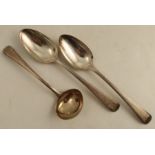 A pair of silver bead edge serving spoons, engraved with a crest, together with matching ladle,