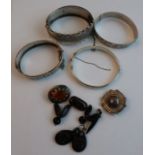 Four various silver bracelets, together with a Scottish type brooch set paste, an agate brooch,