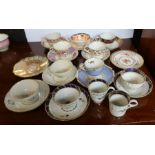 A collection of 19th century English porcelain cups, saucers etc, all decorated in polychrome