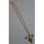 A 9ct gold pendant set with blue paste stones and seed pearls, on a chain, together with pair of