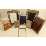 Six hallmarked silver mounted photograph frames, one with Art Nouveau decoration, various sizes,