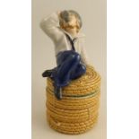 A Minton majolica covered pot, formed as a sailor drinking sitting on a wicker basket, numbered 716,