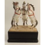 A Royal Worcester model, Circus Horses, modelled by Doris Lindner, with ebonised plinth - Good