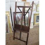An adjustable oak artists easel, stamped Halford Bros. Oxford St, London, height 72ins, width 29ins