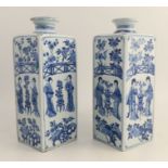 A near pair of Chinese Kangxi canister vases, decorated with figures with a fence and foliage, two