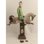 A 20th century Art Pottery model, of an 18th century gent astride a horse, the base inscribed George