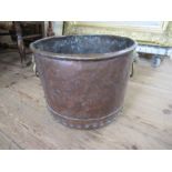 An Antique copper and brass log bin, with lion mask handles, width 16ins, height 13ins