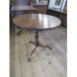 A 19th century oak tripod table, diameter 26ins, height 27ins