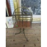 A brass revolving magazine rack, width 14ins, height 34ins