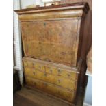 An 18th century walnut secretaire cabinet, the drop down top section revealing drawers, over the