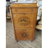 A satinwood and marquetry  inlaid cabinet inlaid all round fitted with one lone drawer over a fall