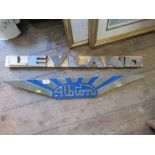 An Albion car sign, together with a Leyland sign