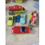 A boxed Corgi Toys Aston Martin D.B.4 218, together with a Dinky Toys boxed Jaguar E Type, a boxed