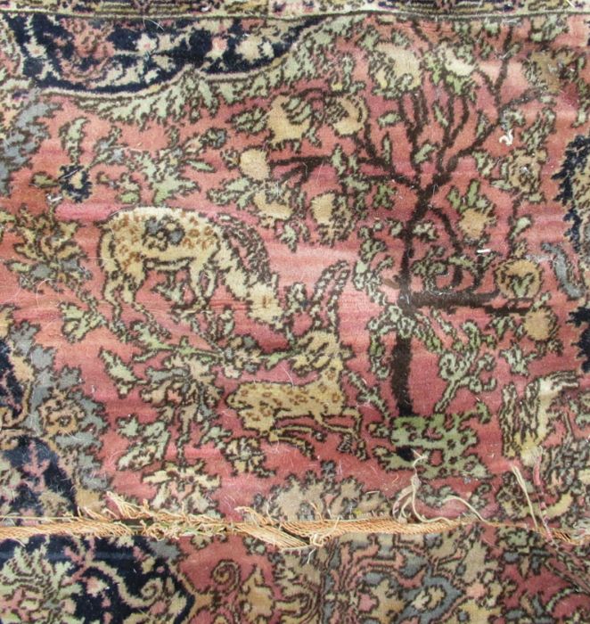 A large rug, decorated with urns, animals and flowers, with similar border, 135ins x 180ins - Image 5 of 6