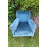 An Edwardian style blue upholstered arm chair