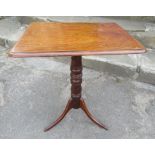 A 19th century rectangular topped tripod table, 23ins x 19ins, height 29ins
