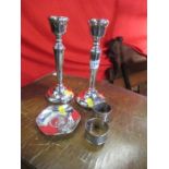 A pair of silver candlesticks, together with a silver dish and two napkin rings