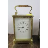 A brass carriage clock, height 7ins including handle