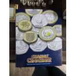 A Change Checker coin folder and coins