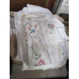 A collection of linen table cloths etc
