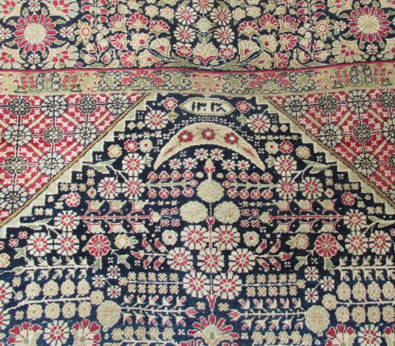 An Eastern design pray rug, the field decorated with a vase of flowers, 56ins x 84ins, together with - Image 2 of 5