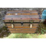 A dome topped wooden banded trunk width 30ins, height 23ins