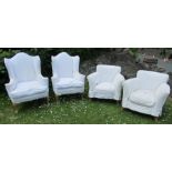 Two pairs of armchairs, with white covers