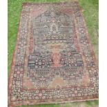 An Eastern design pray rug, the field decorated with a vase of flowers, 56ins x 84ins, together with