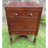 A Victorian mahogany gentleman's wash stand, the hinged top opening to reveal a rising mirror, wells