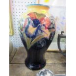 A Moorcroft Potter vase, decorated in the Orchid pattern