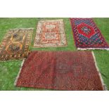 Four Eastern design rugs