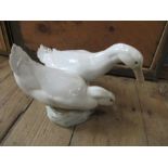 A Royal Copenhagen model, of two white ducks, numbered 412, height 7.5ins - nibbles to tail feathers