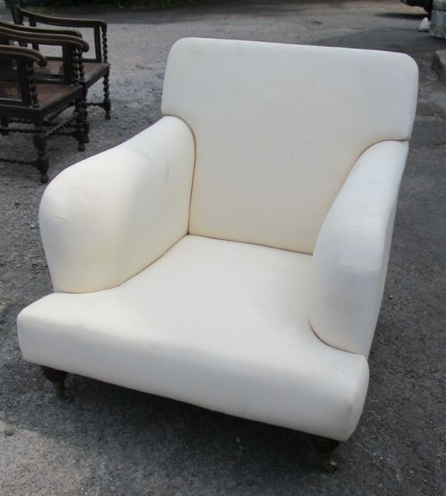 A Howard & Son style upholstered armchair