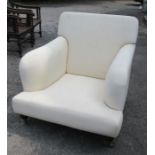 A Howard & Son style upholstered armchair