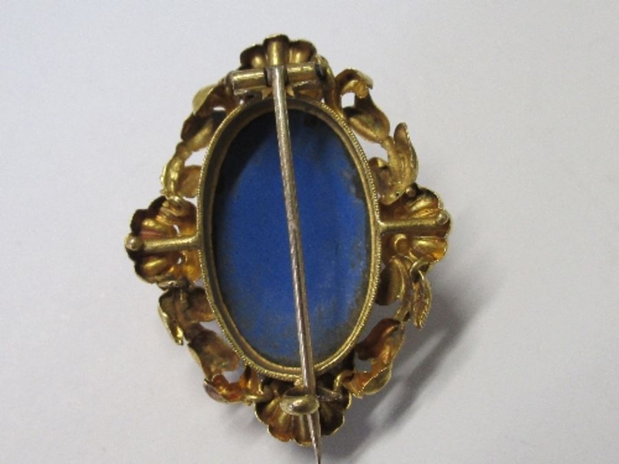 An enamel brooch, with image of woman in national dress, believed to be Swiss, marked Zug, in an - Image 2 of 2