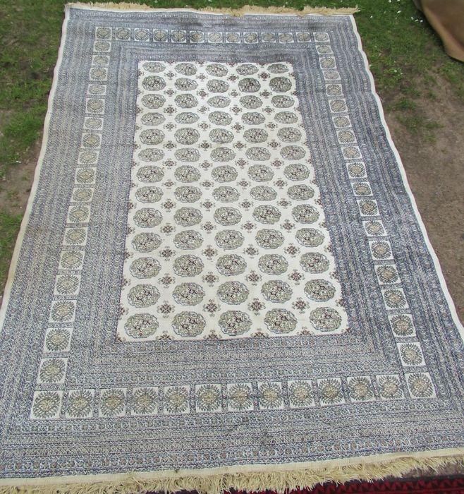 An Eastern design rug, in blue and ream, 62ins x 88ins