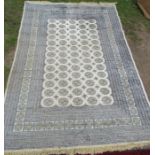 An Eastern design rug, in blue and ream, 62ins x 88ins