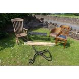 A collection of chairs to include folding bench, bench ends, Windsor rocker, Lloyd Loom style