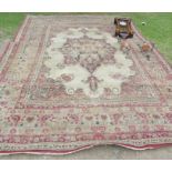 A large Eastern style rug, 119ins x 165ins