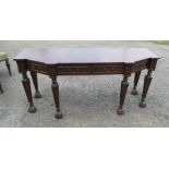 A 20th century walnut veneered sideboard, fitted with frieze drawers, raised on triangular