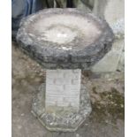 A stone bird bath