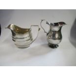 Two hallmarked silver jugs, one with bright cut decoration, the other of baluster form, weight