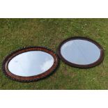 Two oval mirrors