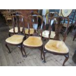 A set of six Queen Anne style dining chairs