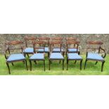 A set of nine Regency mahogany bar back dining chairs, with carved top rail and reeded lower rail,