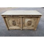 A large antique Italian style oak carved cabinet having carved applied decoration all over, the