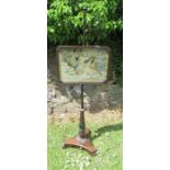 A Victorian rosewood pole screen, the rectangular panel containing a tapestry picture of two dogs by