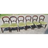 A set of six Victorian balloon back chairs, with carved decoration