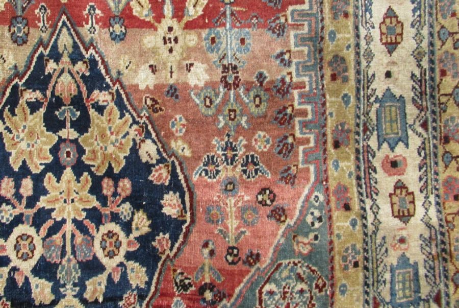 An Eastern design rug, the red ground field decorated with flowers, 36ins x 79ins - Image 2 of 3